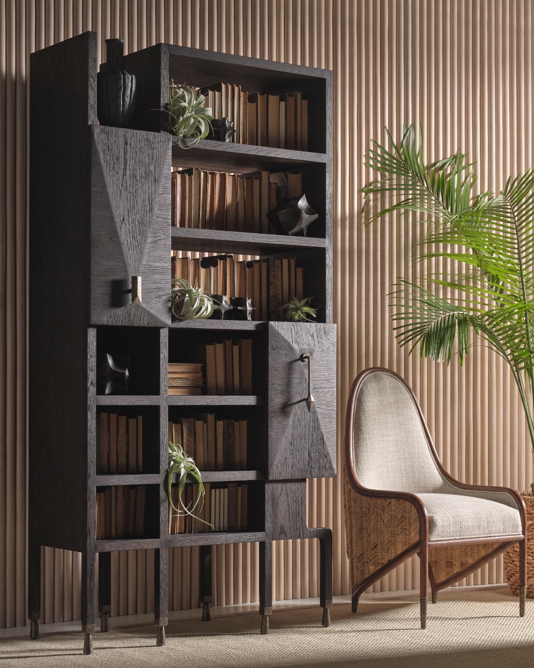 The detailing of The Muntjac’s Library is inspired by the head and horn shape of the muntjac, or barking deer, found in Southeast Asia. This eclectic shelf features an oak case, fossilized brass hardware and two closing compartments. Also featuring the Doug's Throne. Visit the link in our bio for more information. #ThisIsMcGuire #BillBensley