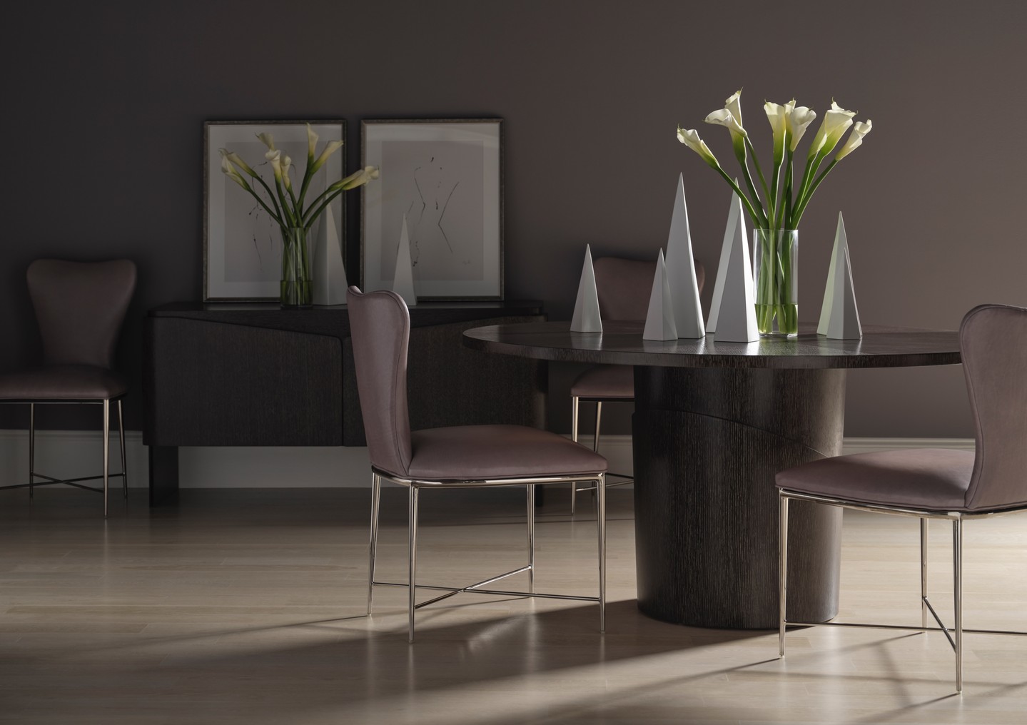 Named after Pablo Picasso’s wife, the Dora Dining Table is an artistic and imaginative piece that appears to be wrapped in multiple layers. This modern dining column features quartered oak veneer. Also featuring the Eva Chair and the Tamara Credenza. Visit the link in our bio for more information. #ThingsChosenWell #BakerLuxe #BakerLuxeCollection